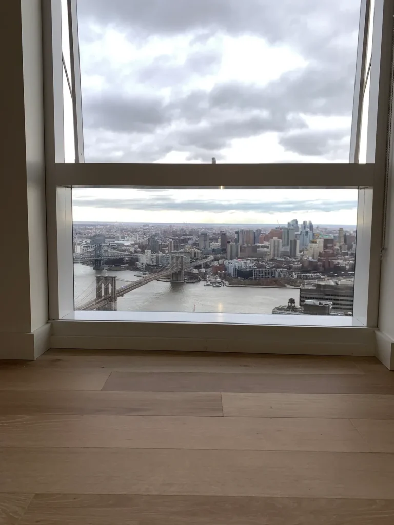 A view of the city from an open window.
