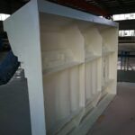 A white shelf in an empty warehouse.