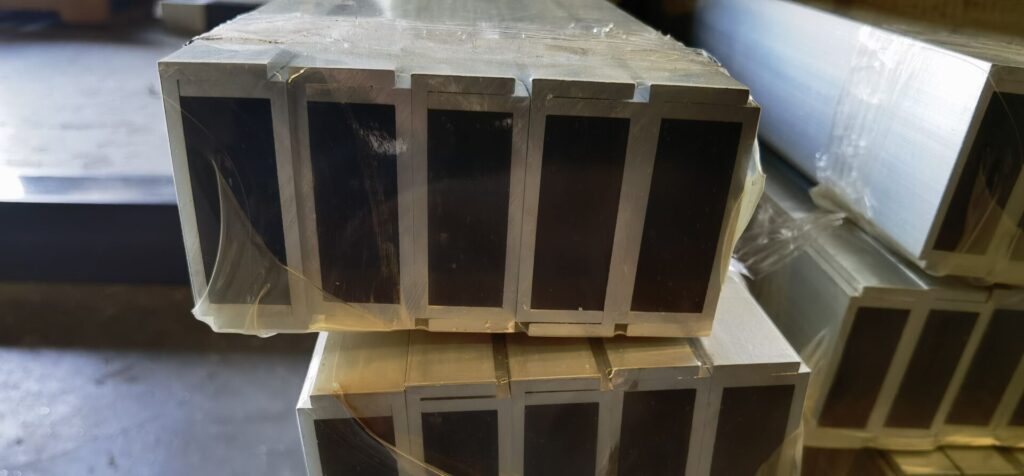 A stack of wooden boxes with some black on them