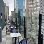 A view of some tables and chairs on the roof.