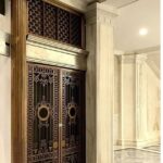 A large door with intricate designs on it.