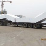 A large truck with a trailer attached to it