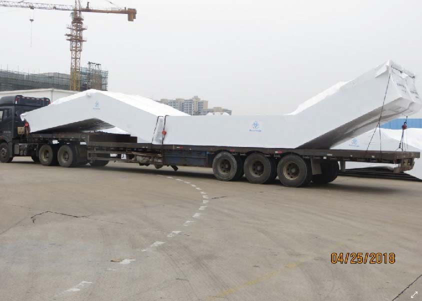 A large truck with a trailer attached to it