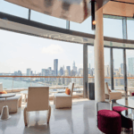 A large open room with a view of the city.