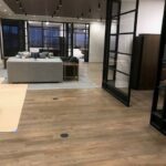 A room with wooden floors and glass doors.