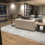 A living room with couches and tables in it