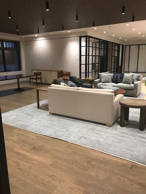 A living room with couches and tables in it