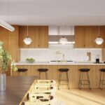 Modern kitchen with wooden accents and black bar stools.
